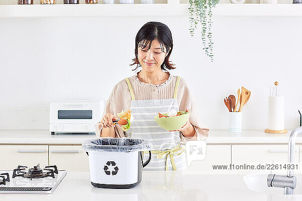 Japanese woman recycling at home