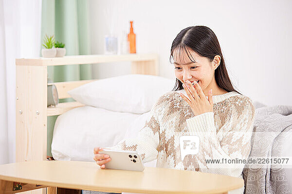 Young Japanese woman at home