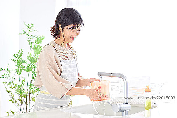 Japanese woman recycling at home