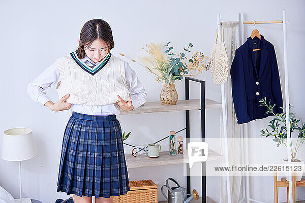 Japanese schoolgirl getting ready at home