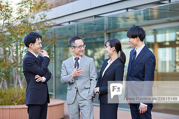 Japanese businesspeople outside
