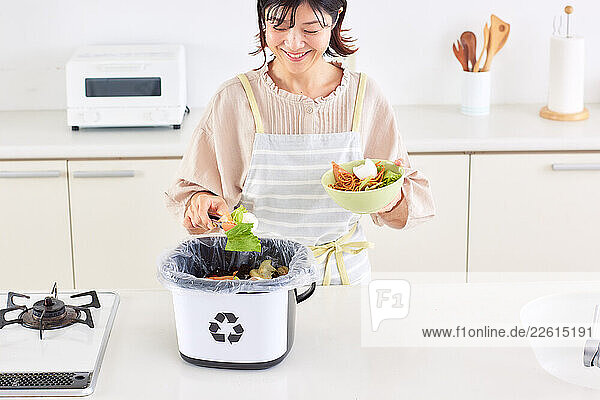 Japanese woman recycling at home