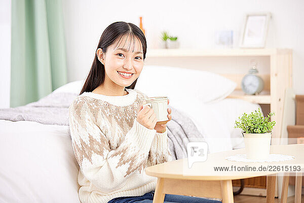Young Japanese woman at home
