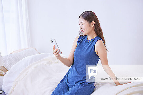 Young Japanese woman at home