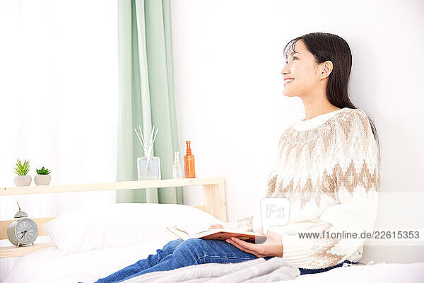 Young Japanese woman at home