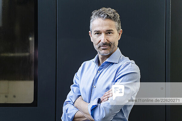 Portrait of a mature businessman  with arms crossed