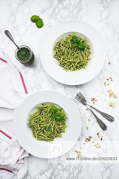 Ligurian trofie pasta with pesto genovese  basil  and parmesan on marble
