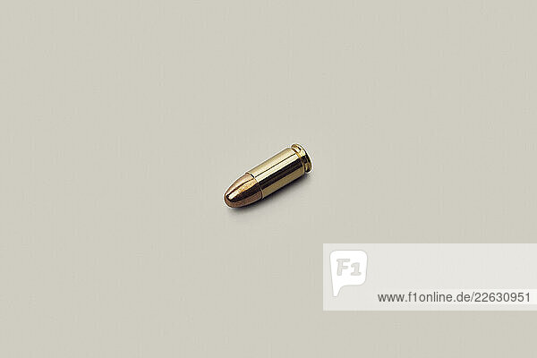 Studio shot 9 x 19mm bullet on white background