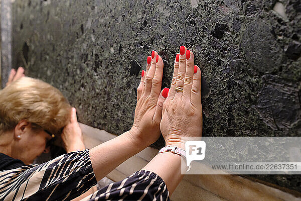 Faithful people touching the grave  Basilica of Saint Anthony of Padua  Padua  Veneto  Italy