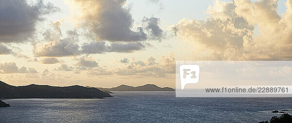 Puffy clouds over Caribbean sea at sunset
