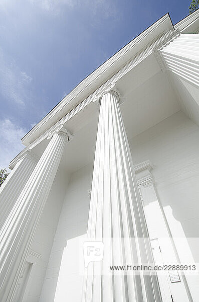 Low angle view of white ionic columns of public library The Atheneum