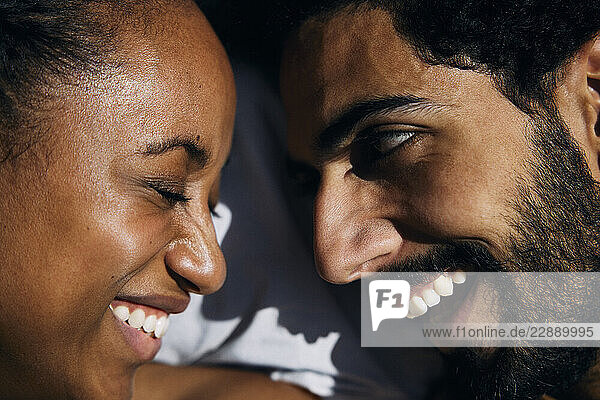 Close-up of happy man and woman face to face