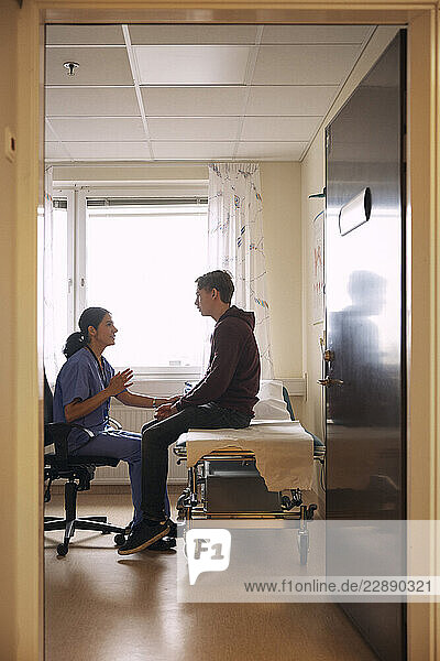 Female doctor discussing with patient in clinic