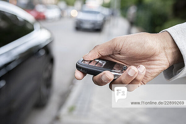Female professional using remote car key
