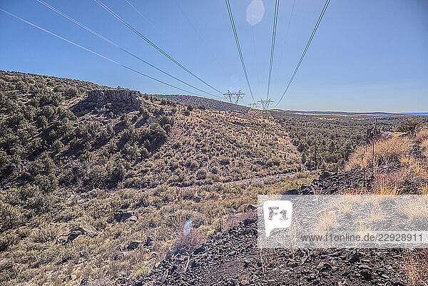 High voltage power lines stretching across Johnson Canyon in the Kaibab National Forest of Arizona  USA
