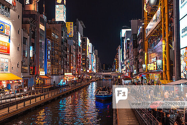 Vibrant illumination  neon signs and billboards. Night time at Dotonbori River Area  Osaka  Kansai  Japan