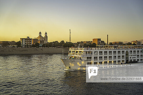 View of cruise boats from cruise boat near Esna on the Nile River at sunset  Esna  Egypt  Africa