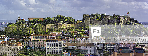 Panoramic view of Lisbon Castle from Miradouro da Senhora do Monte scenic point on a sunny day in the Alfama District  Lisbon  Portugal  Europe
