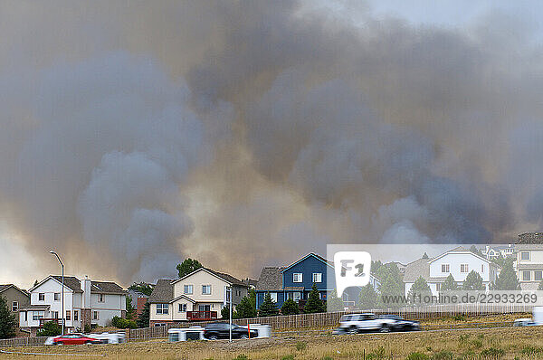 a grass fire near homes.