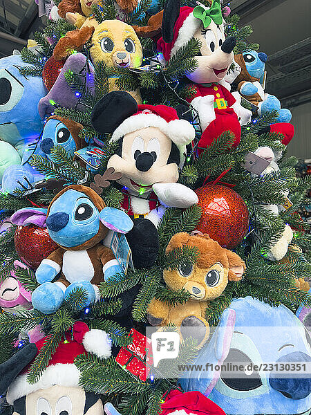 Christmas tree  decorated with Walt Disney plush toys. Mickey  Stitch