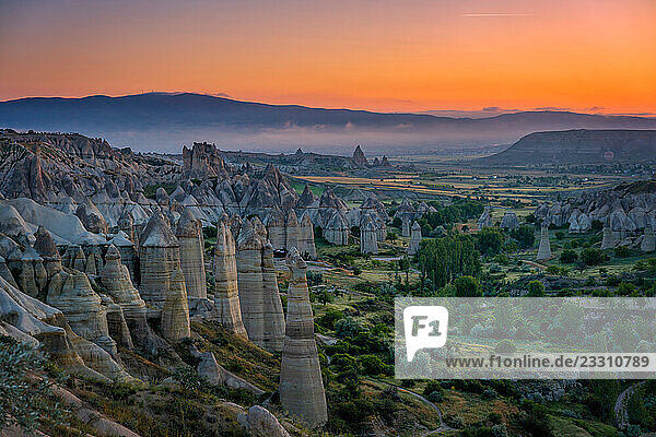 Colorful sunset illuminating Love Valley in Cappadocia  Turkey